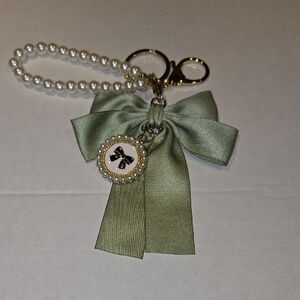 Elegant Green Bow Keychain with Pearl Accents